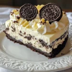 - 24 Oreo cookies, crushed - 4 tablespoons unsalted butter, melted - 16 oz cream cheese, softened - 1 cup heavy whipping cream - 1 cup powdered sugar - 1 teaspoon vanilla extract - Extra Oreo cookies for garnish For this No Bake Oreo Cheesecake, I keep things simple and delightful. The main ingredients work together to create a creamy and rich dessert. First up, Oreo cookies are the star. You will crush them to form the crust and add a great flavor to the filling. Next, we need cream cheese. It gives the cheesecake its smooth and creamy texture. Make sure the cream cheese is soft. This helps it blend well. Heavy whipping cream is another key ingredient. When whipped, it adds lightness and fluffiness to the cheesecake. This makes every bite feel heavenly. Finally, unsalted butter helps bind the crushed Oreos for the crust. It makes the crust hold its shape while still being tasty. Now, let’s talk about the additional ingredients. We have powdered sugar, which sweetens the filling perfectly. Vanilla extract adds a nice touch of flavor. And don’t forget the extra Oreo cookies! They are for garnish. You can use them to add a fun look to your cheesecake. These ingredients come together to create a dessert that everyone will love. You can make this cheesecake for any occasion, and it will impress. {{ingredient_image_1}} To start, I combine the crushed Oreos with melted butter in a bowl. I make sure the crumbs get fully coated with butter. This mix gives our crust a rich flavor. Next, I press the Oreo mixture firmly into the bottom of a 9-inch springform pan. Using my hands or a flat bottomed cup helps shape it evenly. After that, I refrigerate the crust for at least 10 minutes. This step helps it set. Next, I make the filling. I beat the softened cream cheese in a large mixing bowl until it's smooth. This takes about 2-3 minutes. Then, I slowly add powdered sugar and vanilla extract. I keep mixing until it's fully combined and creamy. The last step for the filling is whipping the heavy cream in another bowl. I whip it until soft peaks form. Finally, I fold the whipped cream into the cream cheese mix gently. This keeps the filling light and airy. Now it's time to assemble the cheesecake! I fold in the chopped Oreos, making sure they spread evenly in the mixture. Then, I pour the filling over the chilled crust. I smooth it out with a spatula for an even top. To finish, I cover the pan with plastic wrap and refrigerate it for at least 4 hours. For the best results, I often let it chill overnight. This helps the cheesecake set perfectly. To create a smooth and creamy no-bake cheesecake, start with softened cream cheese. Softened cream cheese blends better. It helps avoid lumps and gives a silky texture. Leave it out at room temperature for 30 minutes before mixing. This step makes a big difference. Whipping heavy cream is also key. Use a clean bowl and beaters for the best results. Whip until soft peaks form. This means the cream holds a shape but is not too stiff. Gently fold the whipped cream into the cream cheese mixture. Overmixing can ruin the lightness of your cheesecake. One common mistake is overwhipping the cream. When you whip too long, the cream can turn grainy. You want it soft and airy. Stop when you see soft peaks. Setting the crust properly is another important step. If you don’t refrigerate the crust long enough, it won’t hold together well. Press the crust firmly into the pan, then chill it for at least 10 minutes. This helps the butter firm up and keeps everything in place. Garnishes can make your cheesecake look extra special. Try adding whole Oreo cookies on top. You could also sprinkle crushed Oreos for a nice touch. Fresh berries or a drizzle of chocolate sauce can add color and flavor. If you want to mix things up, try different cookies in your recipe. Using chocolate wafers instead of Oreos can give a new twist. You can also try different flavored Oreos for a fun change. Each variation brings a unique taste to your cheesecake, making it even more delightful. Pro Tips Crust Consistency: Ensure the crushed Oreo and butter mixture is well-combined for a sturdy crust that holds its shape. Chill Time: For the best texture, refrigerate the cheesecake overnight; this allows the flavors to meld beautifully. Whipping Cream Technique: Whip the heavy cream to soft peaks before folding to maintain a light and airy cheesecake filling. Garnishing Ideas: Get creative with your toppings! Consider adding chocolate shavings or whipped cream along with the Oreos for extra flair. {{image_2}} You can change the cookies in your cheesecake for fun twists. First, try using chocolate wafers instead of Oreos. They create a rich, deep flavor in the crust. If you want to mix it up, combine different flavored Oreos, like mint or peanut butter. This adds a new taste to your cheesecake that is sure to surprise your friends. The filling is where you can get creative! Adding chocolate chips to the mix gives a nice texture and extra sweetness. You can also use other cream cheese flavors, like strawberry or vanilla bean. These flavors can make your cheesecake unique and fun to share. Just remember to keep the balance right, so the cheesecake stays creamy and smooth. How you serve your cheesecake can make it even better. Pair it with fruit toppings like strawberries or raspberries. The fresh fruit adds color and a burst of flavor. You can also serve it with chocolate or caramel sauce. Drizzling sauce on top makes it look fancy and taste even more delicious. To keep your No Bake Oreo Cheesecake fresh, refrigerate it. This dessert stays delicious in the fridge for up to 5 days. If you want to store it longer, freezing is an option. Wrap the cheesecake tightly in plastic wrap and foil before freezing. It can last for about 2 months in the freezer. However, keep in mind that the texture may change slightly after thawing. When serving leftovers, let the cheesecake sit out for about 10 to 15 minutes. This helps bring out the flavors. You can serve it cold, but slightly warmer is often better. For a fun touch, garnish with extra Oreo cookies. Crushed Oreos on top add a nice crunch. You can also drizzle chocolate or caramel sauce for extra flavor. A no bake cheesecake needs to chill for at least 4 hours. For the best results, chill it overnight. This allows the filling to firm up. It also helps the flavors blend together nicely. If you are in a hurry, 4 hours will work, but longer is better. You can use low-fat cream cheese, but it will change the taste and texture. Low-fat versions can make the cheesecake less creamy. The flavor may also be less rich and delicious. So, if you want a smooth and full taste, stick with regular cream cheese. Look for a few signs to know if your cheesecake is ready. First, gently shake the pan. If the middle jiggles slightly but the edges are firm, it is set. You can also touch the surface; it should feel cool and not sticky. When you cut into it, it should hold its shape well. Making a no bake Oreo cheesecake is simple and fun. You’ve learned about the main and extra ingredients, plus how to create the perfect crust and filling. Following the tips helps avoid common mistakes. Remember, you can get creative with flavors and toppings, too. This cheesecake is a great treat for any occasion. Enjoy its rich taste and smooth texture. With these steps, you can impress your friends and family. Your no bake Oreo cheesecake will be a hit!