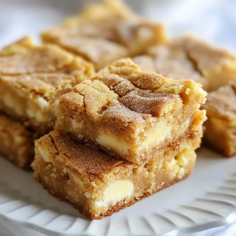 To make tasty Snickerdoodle Blondies, you need the right mix of ingredients. Here is your list: - 1 cup brown sugar - 1/2 cup granulated sugar - 1/2 cup unsalted butter, melted - 2 large eggs - 1 teaspoon vanilla extract - 2 cups all-purpose flour - 1 teaspoon baking powder - 1 teaspoon ground cinnamon - 1/2 teaspoon salt - 1 cup white chocolate chips (optional) - 2 tablespoons granulated sugar (for topping) - 1 teaspoon ground cinnamon (for topping) Each ingredient plays a key role. Brown sugar adds rich flavor. Granulated sugar gives sweetness. Unsalted butter adds moisture and richness. Eggs bind the mix together. Vanilla extract offers a warm aroma. All-purpose flour gives structure. Baking powder helps the blondies rise. Ground cinnamon brings that classic snickerdoodle taste. Salt enhances all the flavors. White chocolate chips add a creamy touch, but you can skip them if you want. Finally, the topping ingredients create a lovely sweet crust. Gather these ingredients, and you’re ready to create a treat that will delight anyone! {{ingredient_image_1}} Start by preheating your oven to 350°F (175°C). Grease a 9x13 inch baking pan. You can also line it with parchment paper. This helps with easy removal later. In a large bowl, whisk together 1 cup of brown sugar and 1/2 cup of granulated sugar. Add in 1/2 cup of melted unsalted butter. Mix until it is smooth. Next, add 2 large eggs one at a time. Mix well after each one. Finally, stir in 1 teaspoon of vanilla extract. In another bowl, combine 2 cups of all-purpose flour, 1 teaspoon of baking powder, 1 teaspoon of ground cinnamon, and 1/2 teaspoon of salt. Gradually add this dry mixture to the wet ingredients. Mix until just combined. If you want, fold in 1 cup of white chocolate chips at this point. Pour the batter into the prepared baking pan. Use a spatula to smooth it out evenly. In a small bowl, mix 2 tablespoons of granulated sugar with 1 teaspoon of ground cinnamon. Sprinkle this mixture evenly over the top of the batter. Bake in the preheated oven for 25 to 30 minutes. The edges should be golden. A toothpick inserted into the center should come out with moist crumbs. Let the blondies cool in the pan for about 10 minutes. Then transfer them to a wire rack to cool completely. Once they are cool, slice into squares. Serve them with a glass of milk for a sweet treat! To get the best texture for your Snickerdoodle blondies, focus on your mixing. Do not overmix the batter once you add the flour. Overmixing can make your blondies tough. Instead, stir gently until you see no dry flour. Also, make sure to bake them just until the edges are lightly golden. This keeps them soft and chewy inside. One common mistake is using cold eggs. Always use room temperature eggs for better mixing. Another mistake is not measuring your flour correctly. Too much flour can dry out your blondies. Make sure to spoon the flour into your measuring cup and level it off. Finally, don’t skip the cinnamon topping! It adds a lovely flavor and texture. For this recipe, use a 9x13 inch baking pan. You can grease it or line it with parchment paper. A whisk is great for mixing the wet ingredients. A spatula helps spread the batter evenly in the pan. Lastly, a toothpick is key for checking doneness. Use it to poke into the center and pull it out. If it comes out with moist crumbs, your blondies are ready! Pro Tips Use Room Temperature Eggs: Allow your eggs to sit at room temperature for about 30 minutes before using them. This helps them incorporate better into the batter, resulting in a smoother texture. Don't Overmix: When combining the wet and dry ingredients, mix until just combined. Overmixing can lead to dense blondies. A few flour streaks are okay! Check for Doneness: Every oven is different, so start checking your blondies a couple of minutes before the suggested baking time. They should be golden around the edges and a toothpick should come out with a few moist crumbs. Let Them Cool: Allow the blondies to cool in the pan for at least 10 minutes before transferring to a wire rack. This helps them set and makes cutting easier. {{image_2}} You can change the vibe of your snickerdoodle blondies with fun mix-ins. Try adding 1 cup of chopped nuts like pecans or walnuts for a crunchy twist. You can also use dried fruit, such as cranberries or cherries, for a sweet and tart kick. If you love chocolate, consider mixing in semi-sweet chocolate chips instead of white chocolate. The key is to keep it balanced so the classic snickerdoodle flavor shines through. To switch up the flavor, consider using different spices. Swap ground cinnamon for pumpkin pie spice for a fall-inspired treat. You can also add a splash of almond extract instead of vanilla for a nutty flavor. Another option is to mix in a little cocoa powder to make chocolate snickerdoodle blondies. Just remember to adjust the flour to keep the right texture. If you need to go gluten-free, there’s a simple fix. Substitute all-purpose flour with a gluten-free flour blend. Make sure it contains xanthan gum for the best texture. You can also use almond flour for a nutty taste. Just keep in mind that the blondies might bake a little differently. Always test with a toothpick to check for doneness. Enjoy your gluten-free snickerdoodle blondies without missing out on flavor! To keep your snickerdoodle blondies fresh, store them in an airtight container. This helps keep them soft and gooey. You can also add a piece of bread in the container. The bread helps retain moisture. Keep them at room temperature for up to five days. If you want them to last longer, consider refrigerating them. Just remember to let them come back to room temp before eating for the best taste. Freezing blondies is easy and great for later enjoyment. First, make sure they are completely cooled. Then, cut them into squares. Wrap each piece in plastic wrap tightly. After that, place the wrapped squares in a freezer bag or container. Label the bag with the date. Your blondies can stay fresh in the freezer for up to three months. When ready to eat, thaw them in the fridge overnight. To enjoy warm blondies, you can reheat them quickly. Place a square in the microwave for about 10-15 seconds. Check if it’s warm enough. If you want them warm and a bit crisp, pop them in the oven. Set your oven to 350°F (175°C) and heat for about 5-7 minutes. Enjoy them with a glass of milk for a special treat! You can use unsweetened applesauce as an egg substitute. Use 1/4 cup for each egg. Another option is mashed banana. It adds moisture and sweetness. Silken tofu works too; blend it until smooth. Each choice gives a slightly different taste, but all keep the blondies moist. Yes, you can use only brown sugar. It will make the blondies softer. They will also be chewier with a richer flavor. If you want them less sweet, mix brown sugar with a bit of granulated sugar. This combination gives balance and depth. Check for a golden edge and a slight puff in the middle. Insert a toothpick in the center. If it comes out with moist crumbs, they are ready. You want a little stickiness but not wet batter. Keep an eye on baking time; it can vary with ovens. Absolutely! Leave out the white chocolate chips if you prefer. The blondies will still taste amazing. You can add nuts or raisins for a different texture. Cinnamon and sugar on top will give that classic snickerdoodle flavor. Enjoy them your way! You learned how to make delicious blondies from scratch. We covered each ingredient, from sugars to optional mix-ins. I shared easy steps to bake them perfectly. You now know tips for the best texture and common mistakes to dodge. Explore fun variations and storage methods to keep these treats fresh. You can confidently make blondies that fit your taste. Whether for a snack or dessert, these blondies will impress everyone. Enjoy baking!