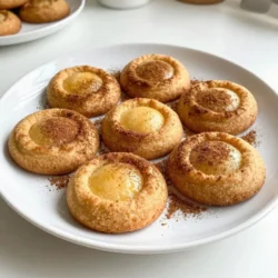 Chai Spice Snickerdoodles use simple yet flavorful ingredients. Here’s what you need: - 2 3/4 cups all-purpose flour - 1 teaspoon baking soda - 1/2 teaspoon cream of tartar - 1 teaspoon ground cinnamon - 1 teaspoon ground ginger - 1/2 teaspoon ground cardamom - 1/4 teaspoon ground cloves - 1/4 teaspoon nutmeg - 1/2 teaspoon salt - 1 cup unsalted butter, softened - 1 1/2 cups granulated sugar - 1/4 cup brown sugar, packed - 2 large eggs - 1 teaspoon vanilla extract - 1/4 cup granulated sugar (for rolling) - 2 teaspoons ground cinnamon (for rolling) These ingredients blend to create a rich, spiced flavor. The chai spices give these cookies a warm, cozy touch. The butter and sugars make them soft and sweet. You can find most of these in your pantry or at any grocery store. Gather your ingredients before you start. This helps keep your space organized and makes baking smoother. Each ingredient plays a key role in the final taste and texture. So, use fresh spices and quality butter for the best results. Happy baking! {{ingredient_image_1}} First, preheat your oven to 350°F (175°C). Line your baking sheets with parchment paper. This step keeps the cookies from sticking. Next, in a medium bowl, whisk together the flour, baking soda, cream of tartar, spices, and salt. The spices include cinnamon, ginger, cardamom, cloves, and nutmeg. This mix gives the cookies their warm chai flavor. In a large bowl, cream together the softened butter, granulated sugar, and brown sugar. Mix until it becomes light and fluffy. This takes about 2 to 3 minutes. Then, add the eggs one at a time. Mix well after each egg. Stir in the vanilla extract for more flavor. Gradually add the dry mixture to this wet mix. Stir until just combined. Next, in a small bowl, combine the 1/4 cup granulated sugar with the 2 teaspoons of ground cinnamon. This will coat the cookies and add sweetness. Now, use a cookie scoop or your hands to form dough balls about 1.5 inches in size. Roll each ball in the cinnamon-sugar mixture to coat. Now, place the coated dough balls on the prepared baking sheets. Make sure to leave enough space between them. The cookies will spread while baking. Bake the cookies in your preheated oven for 10 to 12 minutes. You want the edges to be lightly golden while the centers stay soft. Let the cookies cool on the baking sheet for about 5 minutes. After that, transfer them to a wire rack to cool completely. Cooling on the rack helps them maintain their texture. For a beautiful presentation, serve the cookies on a rustic wooden platter. Dust them with a little extra ground cinnamon for a lovely touch. These cookies pair perfectly with your favorite chai tea. Enjoy this delightful treat with friends or family during the holidays! - Achieving the perfect softness: To get soft cookies, do not overbake them. Bake until the edges are just golden. The centers should look soft. They will firm up as they cool. This gives you that chewy texture we all love. - Enhancing spice flavors: Use fresh spices for the best taste. Grind whole spices yourself if you can. Adding a pinch of extra cinnamon or ginger to the dough can also boost flavor. This small tweak makes a big difference. - Overmixing the dough: Mix until the ingredients just blend. Overmixing can make your cookies tough. Be gentle when combining the wet and dry ingredients. - Baking time adjustments: Every oven is different. Start checking your cookies at 10 minutes. If they need more time, check every minute until done. Remember, less time in the oven means softer cookies. Pro Tips Chill the Dough: For even better texture and flavor, chill the dough for at least 30 minutes before baking. This helps the cookies maintain their shape and enhances the spices. Use Fresh Spices: For the most aromatic and flavorful cookies, use freshly ground spices instead of pre-ground. This will elevate the chai flavor in your snickerdoodles. Don’t Overbake: To keep the centers soft and chewy, take the cookies out of the oven when the edges are golden but the centers look slightly underbaked. They will continue to cook on the baking sheet. Experiment with Add-ins: Feel free to add your favorite mix-ins like chocolate chips, nuts, or dried fruit to the dough for a fun twist on the classic snickerdoodle. {{image_2}} You can easily switch up the flavors in your chai spice snickerdoodles. Adding chocolate chips or nuts can give your cookies a new twist. Just mix in about a cup of your choice. Dark chocolate or walnuts work well with the chai spices. You can also try different spices. For example, swap out the ground ginger for ground allspice. Each spice will change the taste, making it unique. If you need gluten-free options, use a gluten-free flour blend. Many brands work well in cookies. Just make sure it has a good structure. For vegan alternatives, substitute the eggs with flax eggs. Mix one tablespoon of ground flaxseed with three tablespoons of water. Let it sit for a few minutes until it thickens. For the butter, you can use coconut oil or a vegan butter substitute. These swaps keep your cookies tasty and friendly for different diets. To keep your Chai Spice Snickerdoodles fresh, use an airtight container. Glass jars or plastic containers work well. Make sure the cookies cool completely before sealing them. This helps prevent moisture buildup. Store them in a cool, dry place. Avoid areas with high humidity, as this can make cookies soggy. If you live in a humid area, consider putting a piece of bread in the container. The bread helps absorb moisture and keeps cookies soft. At room temperature, your cookies last about five days. To maximize freshness, check for any signs of spoilage before enjoying. If you want to keep them longer, freezing is a great option. Place the cooled cookies in a freezer-safe bag. Remove as much air as possible before sealing. You can freeze them for up to three months. When ready to eat, just thaw them at room temperature for a few hours. Enjoy your delightful treat! What can I substitute for cream of tartar? You can use white vinegar or lemon juice. Use 1 teaspoon for each teaspoon of cream of tartar. This will help your cookies rise and keep a nice texture. Can I chill the dough before baking? Yes, chilling the dough helps. It makes the cookies thicker and less spread out. Chill for at least 30 minutes before baking. How do I know when the cookies are done baking? Look for lightly golden edges. The center should still look soft. They will firm up as they cool. Can I make the dough ahead of time? Absolutely! You can make the dough and keep it in the fridge for up to three days. Just let it warm up a bit before scooping and baking. Are there stores that sell Chai Spice Snickerdoodles? Some local bakeries may sell them. You can also find them at specialty shops or farmers' markets during the holidays. You learned how to make delicious Chai Spice Snickerdoodles. We covered ingredients, step-by-step prep, and baking. Don’t forget the serving ideas and tips for the right texture. Variations let you customize flavors, and storage tips keep your cookies fresh longer. Baking is fun, rewarding, and a great way to share with friends. Enjoy every bite of your tasty treats!